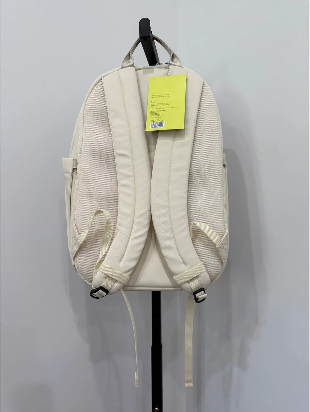 All in Motion Minimalist Cream Backpack with Side Pockets and Padded Straps